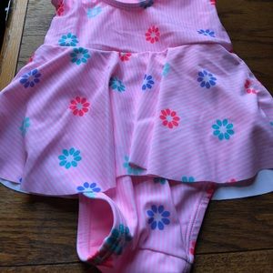 Cute pink toddler swim suit with frills